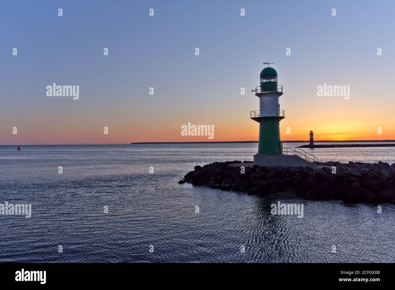 Lighthouse at Warnemünde Port While Sunrise, Rostock, Baltic Sea, Mecklenburg Western Pomerania, Germany, Europe Stock Photo