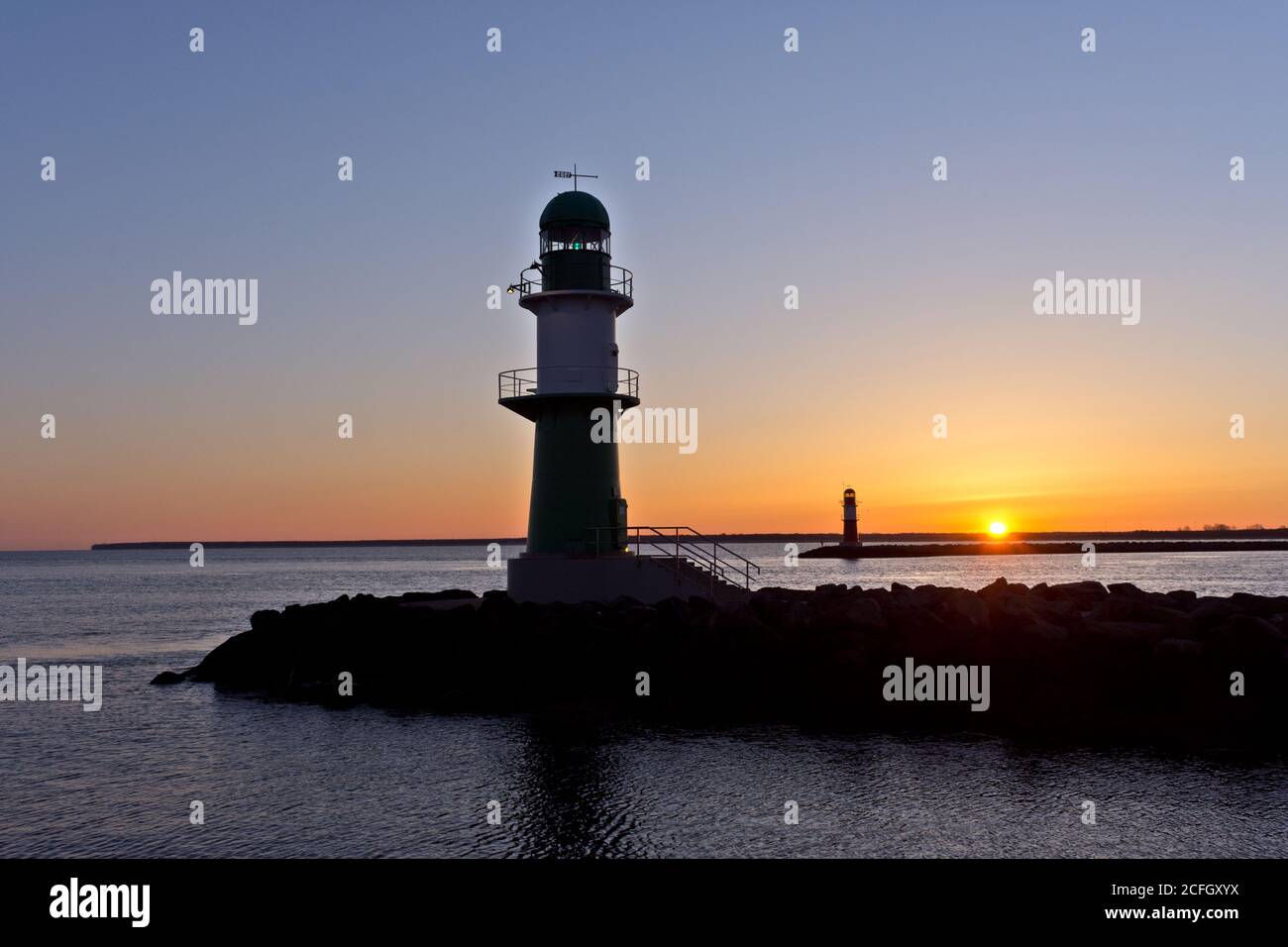 Lighthouse at Warnemünde Port While Sunrise, Rostock, Baltic Sea, Mecklenburg Western Pomerania, Germany, Europe Stock Photo