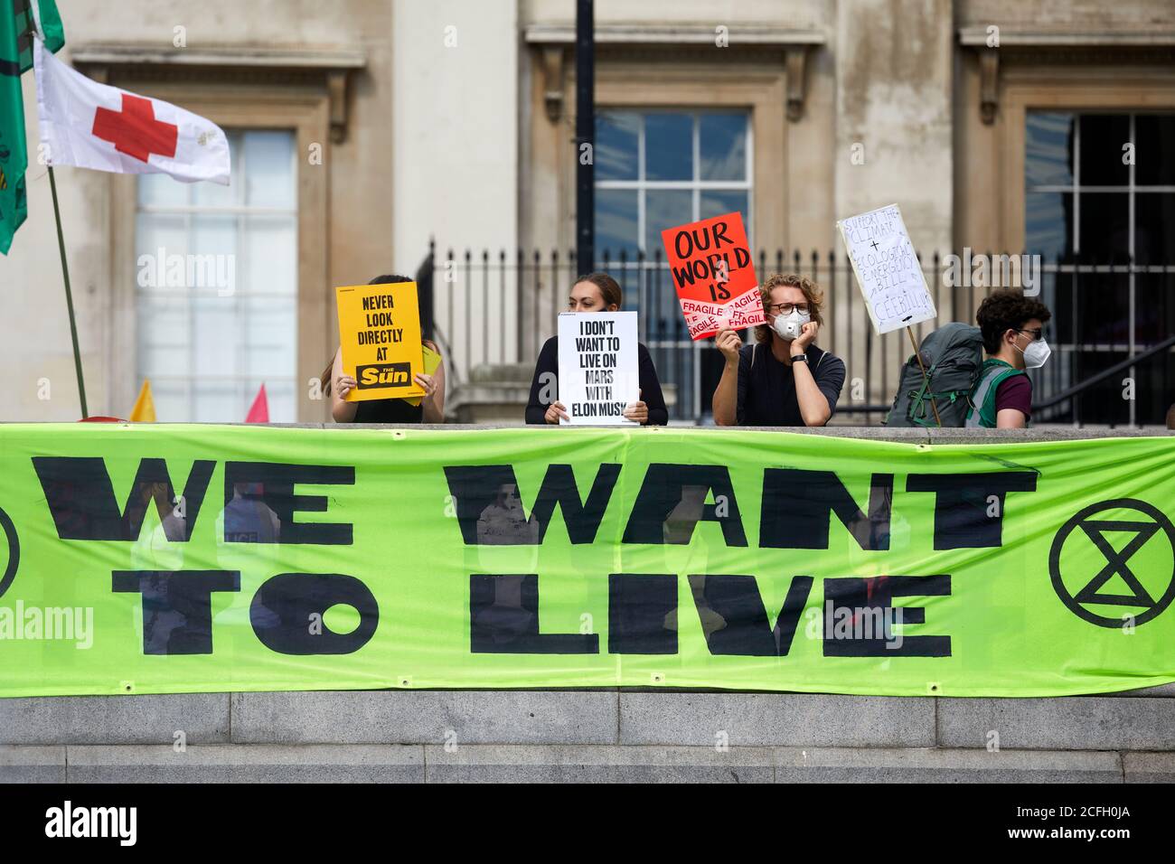 London, UK. - 5 Sept 2020: Protestors hold up placards at an Extinction Rebellion rally in Trafalgar Square. Stock Photo