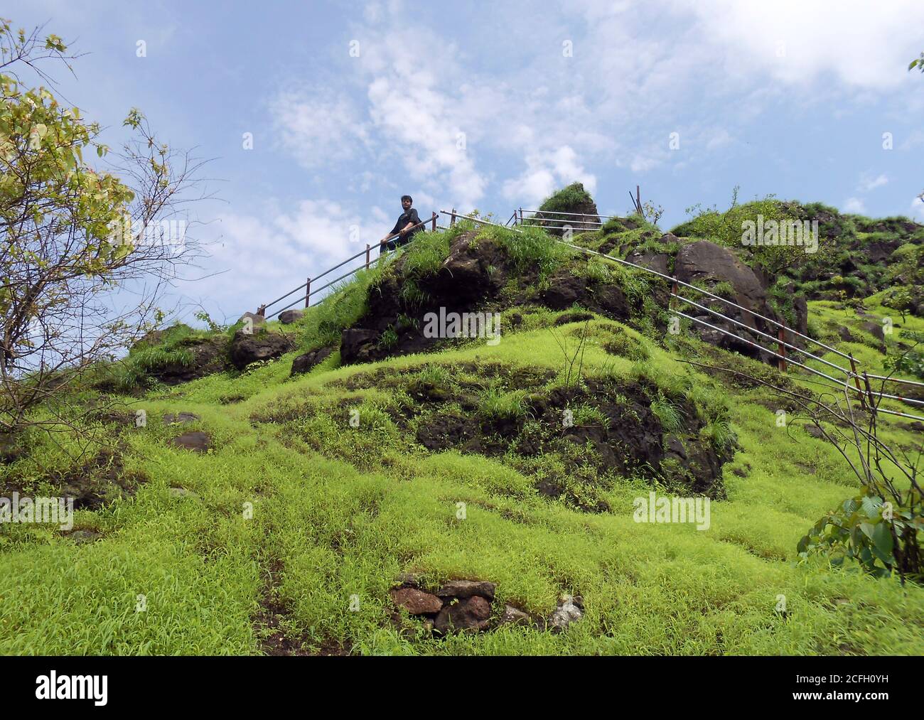 Man standing railing peak hi-res stock photography and images - Alamy