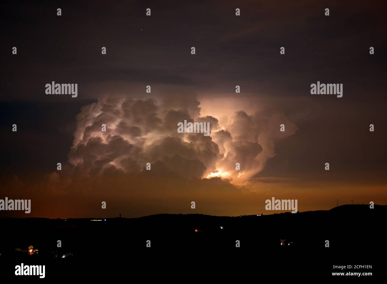 thunderstorm, darkness, stormy dark clouds moving across the sky, slow shutter speed. Stock Photo
