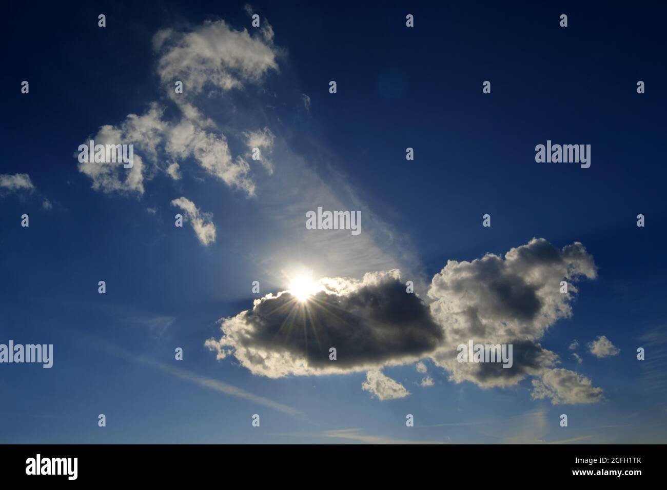 Sunlight behind the cloud on the dramatic moody sky Stock Photo