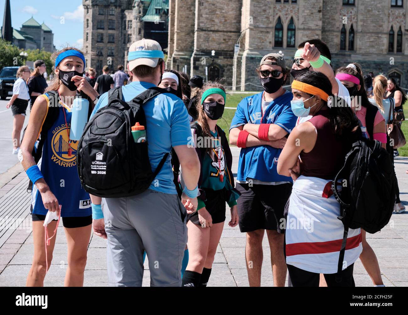 University of Ottawa students on an adventure race around the Capital as New year starts. Participants in outfits of various sports teams Stock Photo