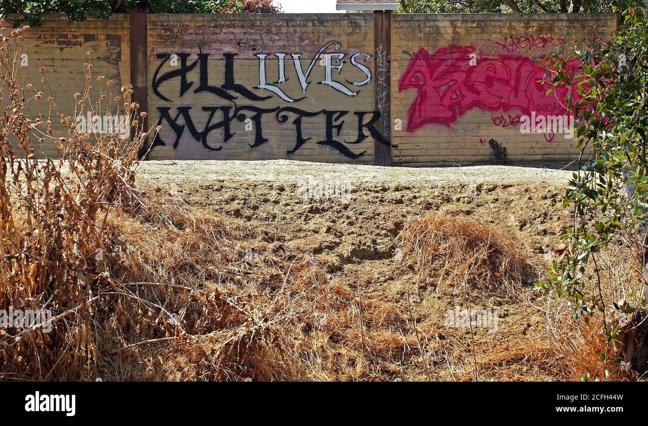 All Lives Matter graffiti on wall next to Old Alameda Creek in Union City, California Stock Photo