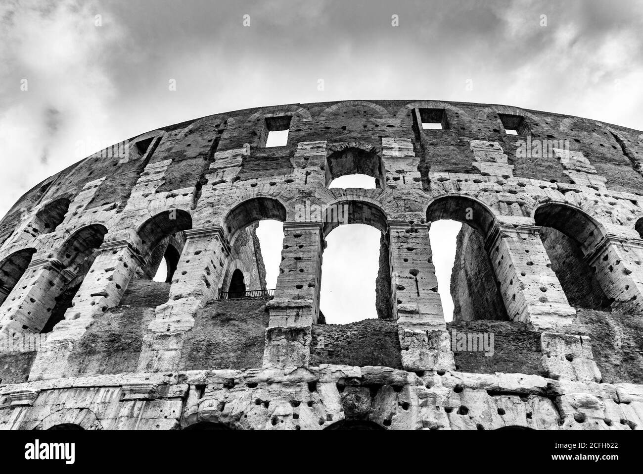 Colosseum, Coliseum or Flavian Amphitheatre, in Rome, Italy. Detailed view of facade. Black and white image. Stock Photo