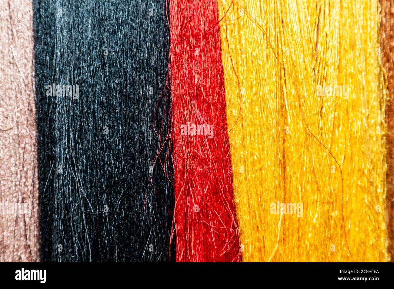 Threads of raw silk, scene in silk factory in Cambodia. Silk direct from the cocoons of silk worms. Silk fabric was invented in Ancient China and play Stock Photo