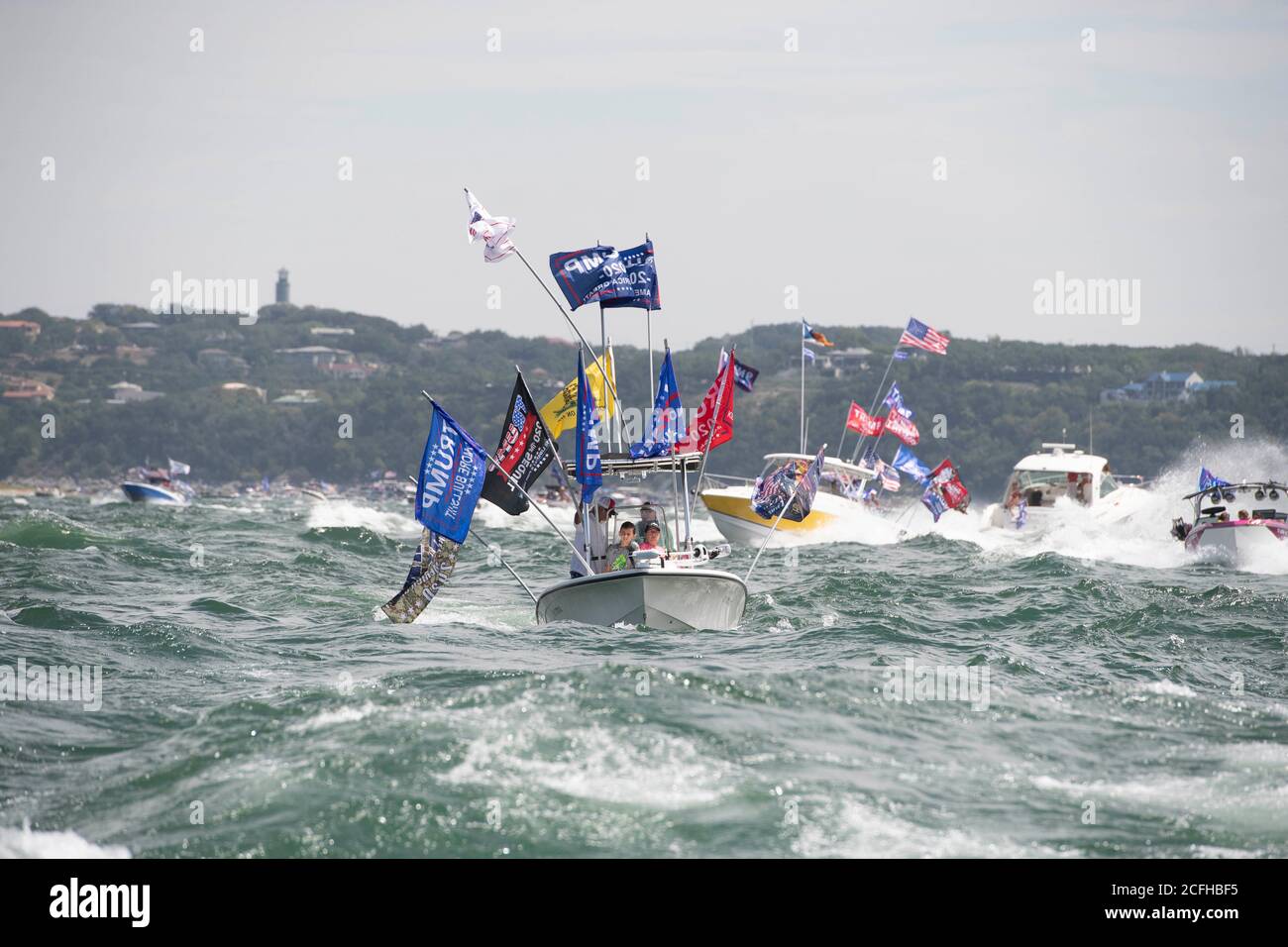 Lakeway Texas USA. 5th Sep 2020. Boats flying flags honoring