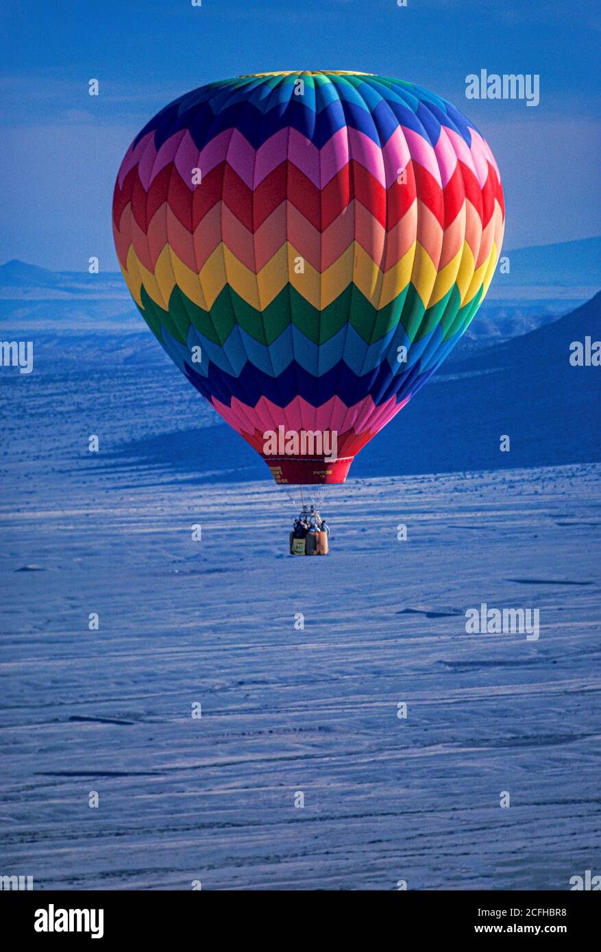 Hot Air Balloon near foothills of Sandia Mountains, Albuquerque, NM Stock Photo