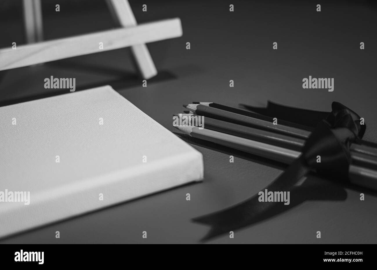 Drawing pencils with wooden easel; Black and white style Stock Photo ...