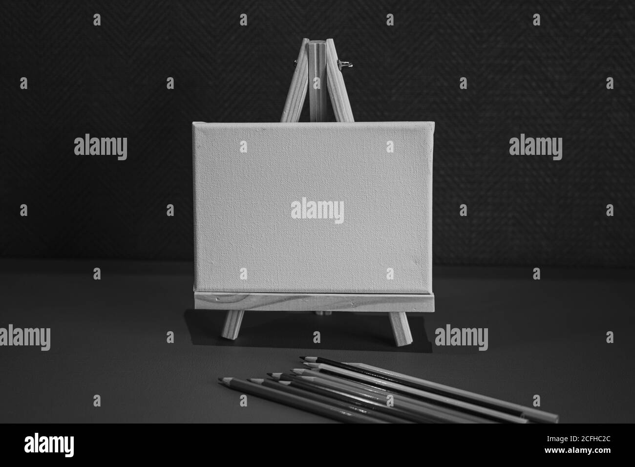 Drawing pencils with wooden easel; Black and white style Stock Photo ...