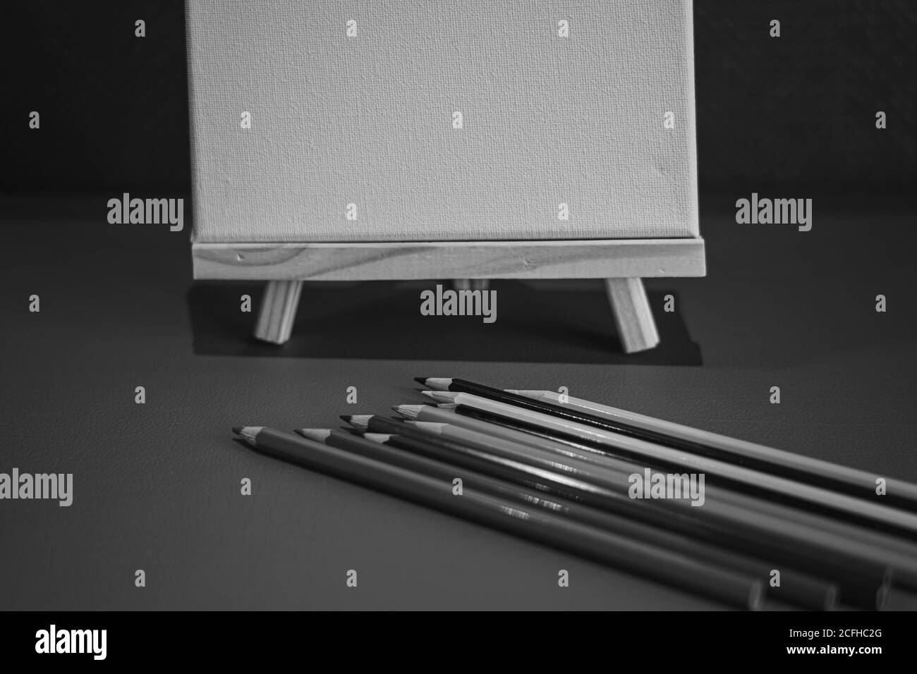 Drawing pencils with wooden easel; Black and white style Stock Photo ...