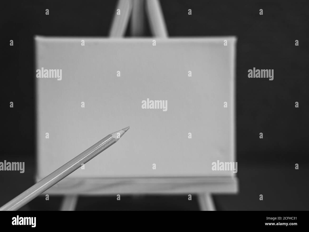 Drawing pencils with wooden easel; Black and white style Stock Photo ...