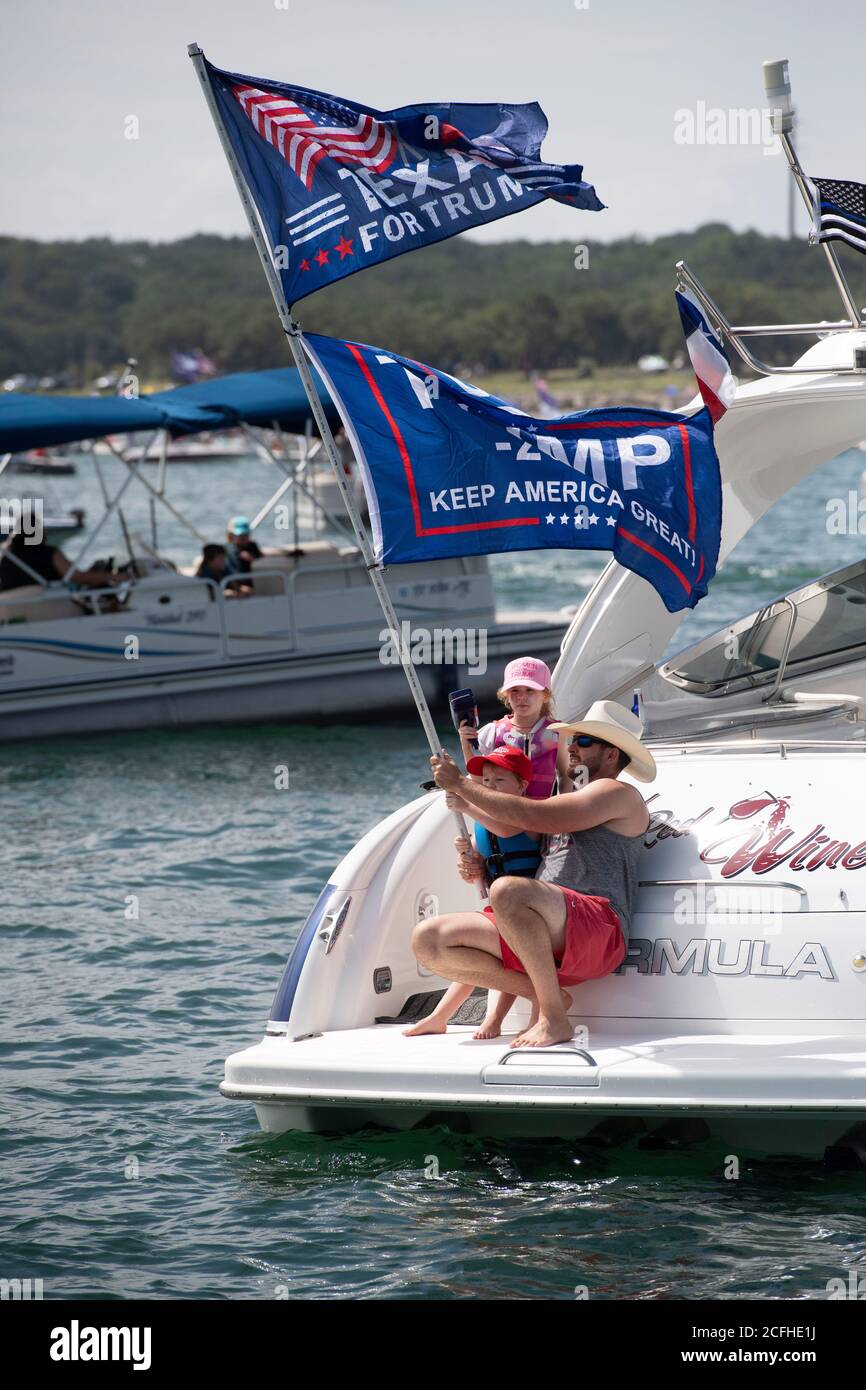 Lakeway, Texas USA Sept. 5, 2020: A boat parade to show support for U.S. Pres. Donald Trump attracted hundreds of watercraft of all sizes, most of them flying multiple Trump flags. Several boats were swamped or sunk in the huge waves kicked up by the flotilla's wakes but no injuries were reported. Credit: ©Bob Daemmrich/Alamy Live News Stock Photo