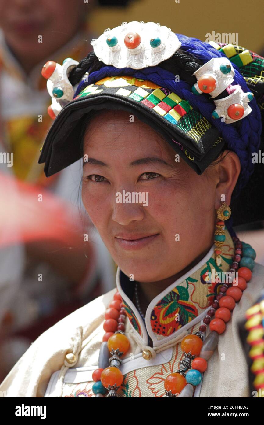 Close-up of a Qiang Tibetan woman in traditional costume, Zhoukeji ...