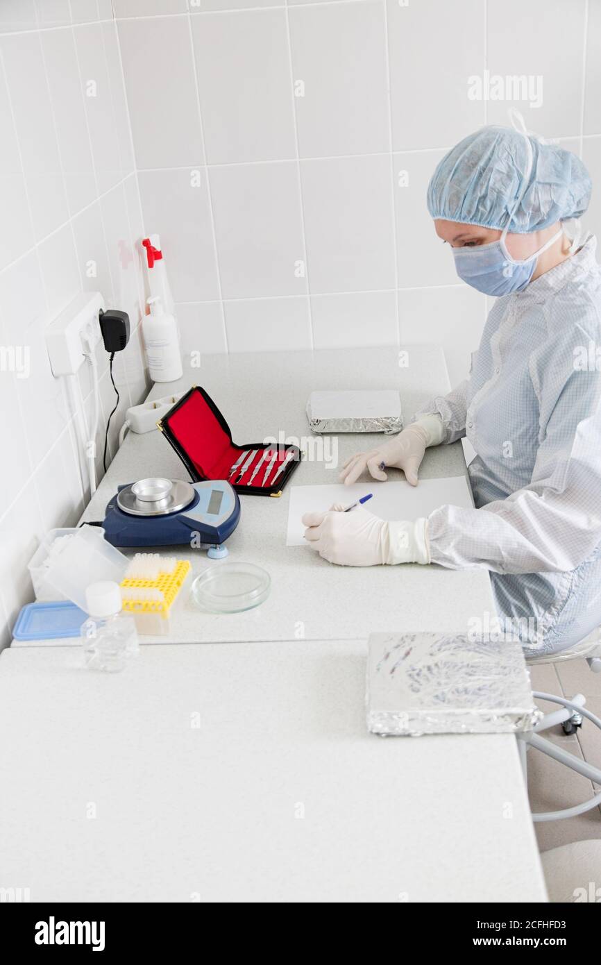 Doctror writes a note in the laboratory Stock Photo