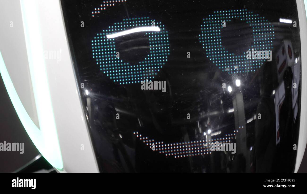 Robot shows bright emotions smiling. Stock Photo