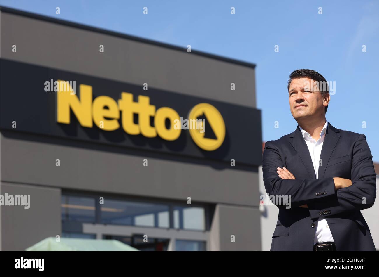 03 September 2020, Mecklenburg-Western Pomerania, Malchin: Managing Director Ingo Panknin of the retail chain Netto ApS & Co. KG is standing in front of a Netto branch. The first branch opened 30 years ago in Vorpommern. In the meantime, the company is one of the largest in the northeast of Germany with about 6000 employees. So far, the discounter has been represented 112 times in Mecklenburg-Western Pomerania alone, 143 times in Berlin and Brandenburg as well as in Saxony, Saxony-Anhalt, Lower Saxony, Hamburg and Schleswig-Holstein. (to dpa 'Only MV retail chain wants to grow - Corona crisis Stock Photo