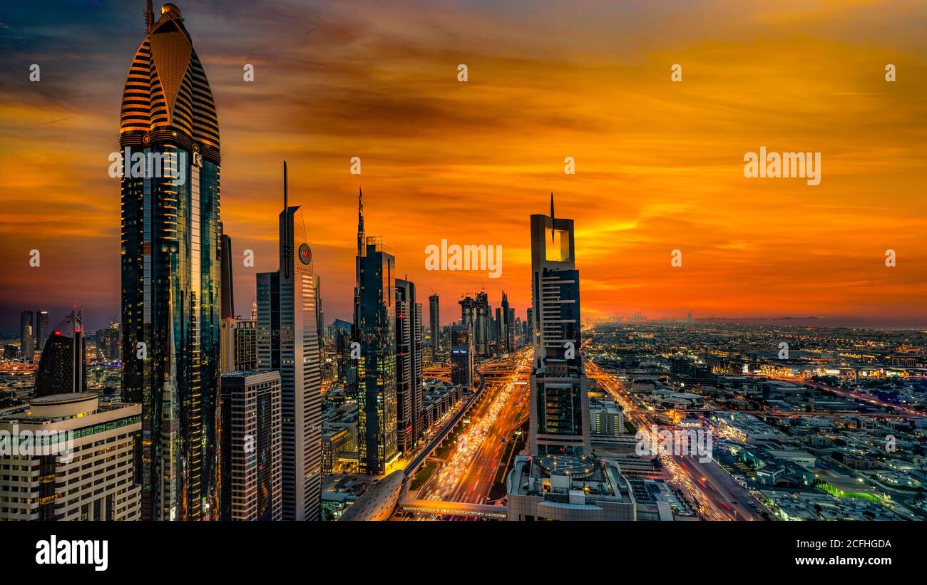 A view of the city skyline at sunset from the financial district of downtown Dubai, UAE, Middle East. Stock Photo