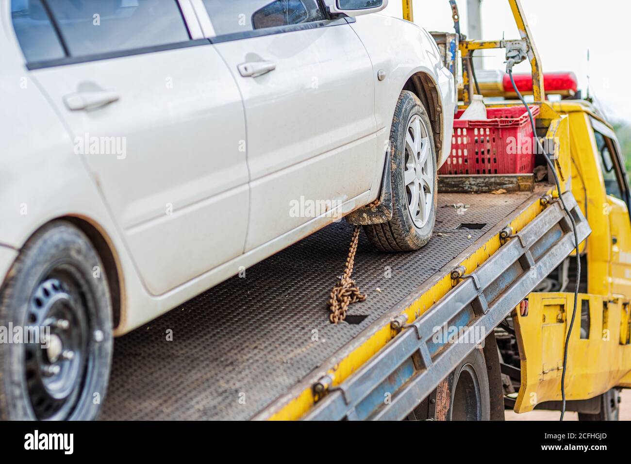 chain bind car wheel on car tow in the park. Damage and accident car