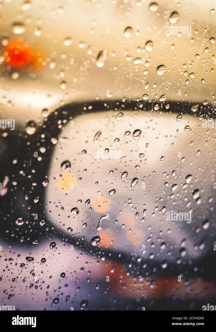 Blurred rain drop on the car glass background, water drops at the car