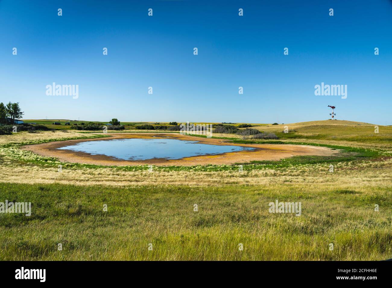 A small prairie pond in rural Saskatchewan, Canada. Stock Photo