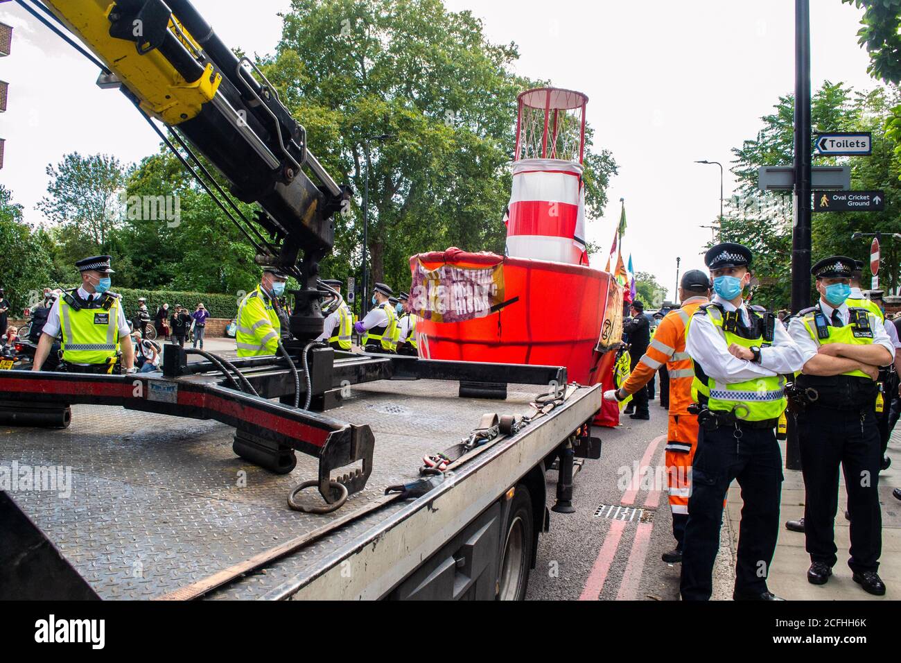 KENNINGTON, LONDON/ENGLAND - 5 September 2020: Extinction Rebellion's “Lightship Greta” boat being dismantled by police on Kennington Park Road Stock Photo