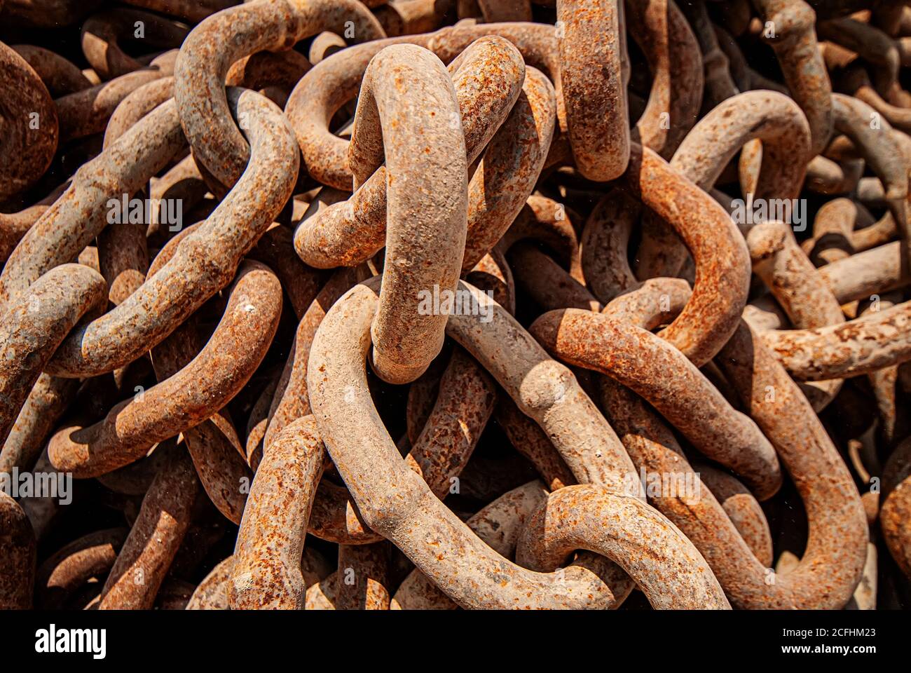 old rusty industrial chains for lifting loads, closeup. Industrial