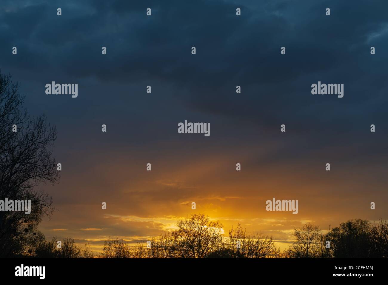Spring Dark Weather Sunset and dark rain clouds. Early spring in the countryside Stock ...