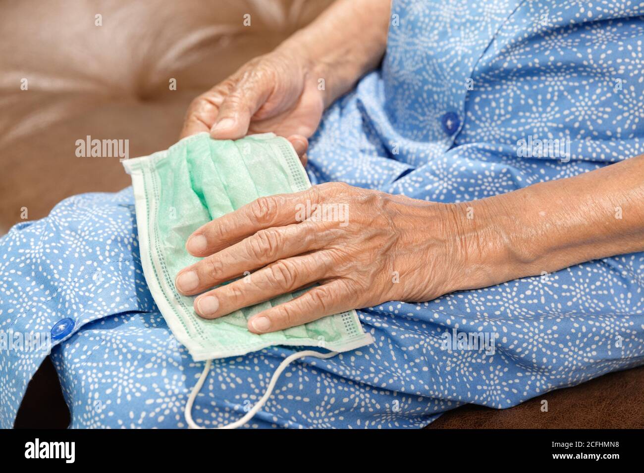 Elderly woman wearing a mask hi-res stock photography and images - Alamy