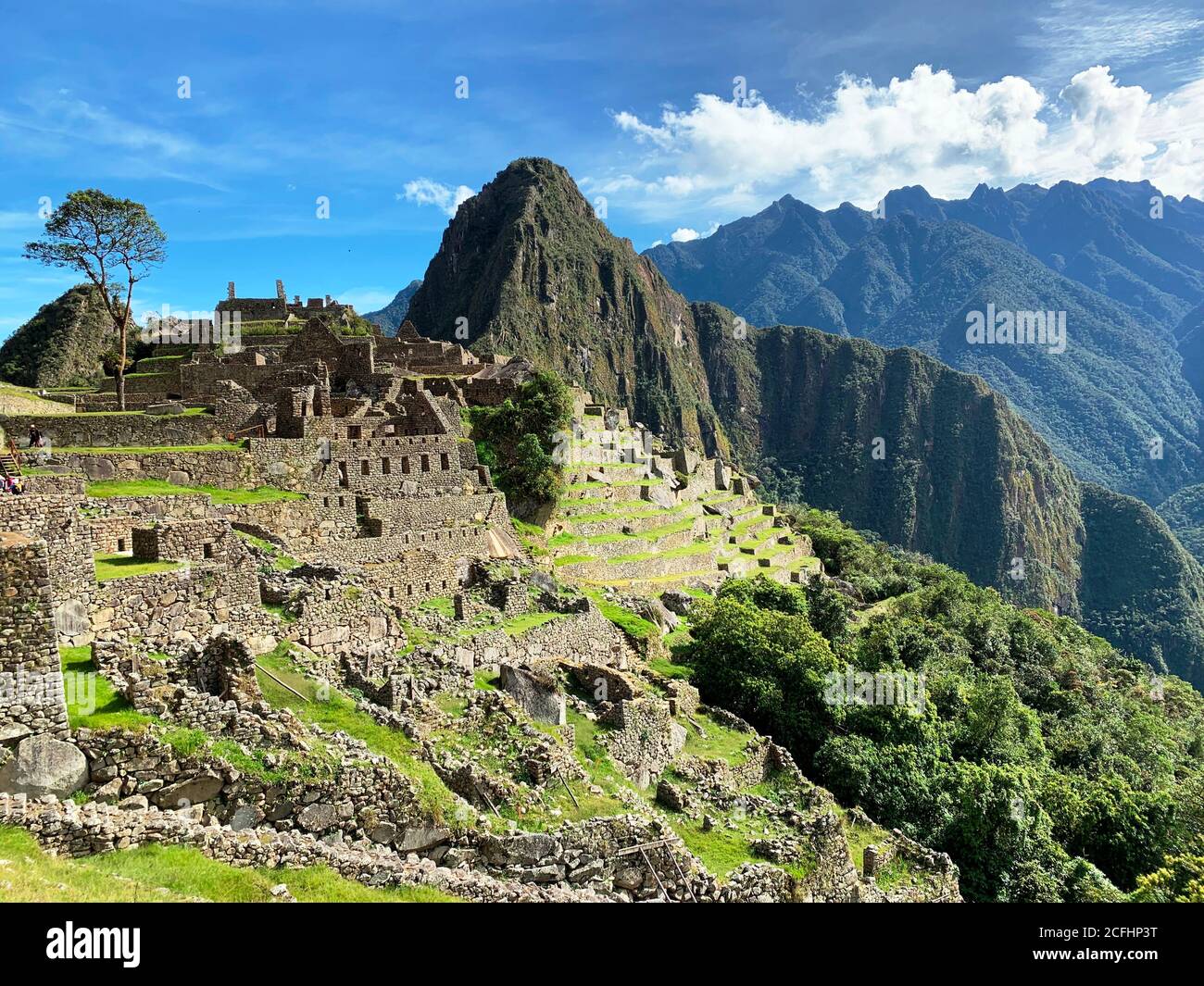 Machu Picchu is city of Inca civilization, located in Andes in territory of Peru, above valley of Urubamba. Huayna Picchu mountain. Great landmark. Stock Photo