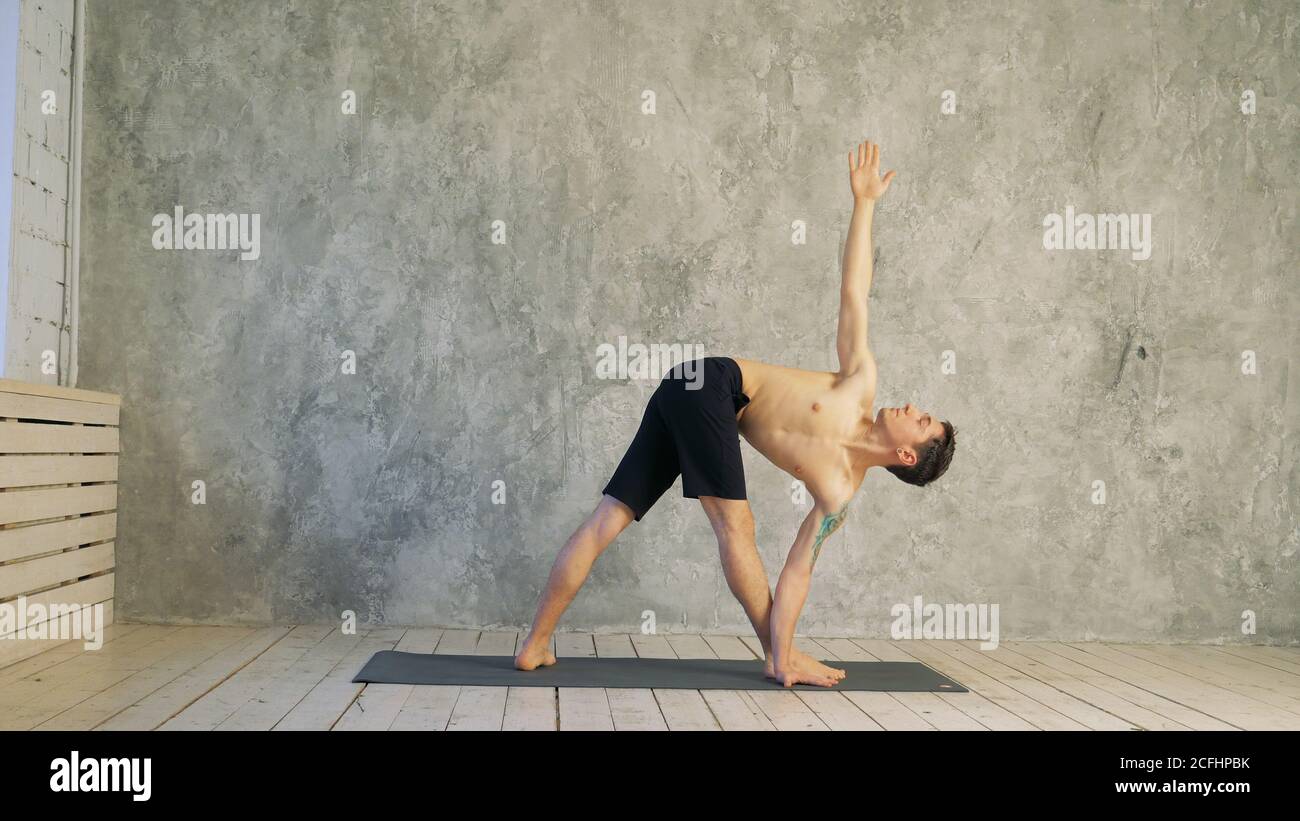 Yoga position asana healthy life exercise concept - Man doing As Stock Photo