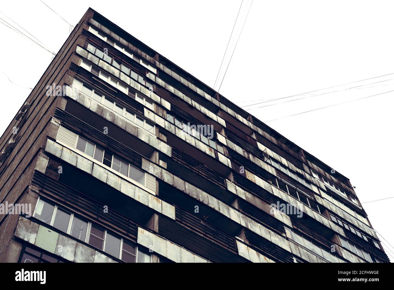 Low angle shot of the facade of an old multi-story residential building ...