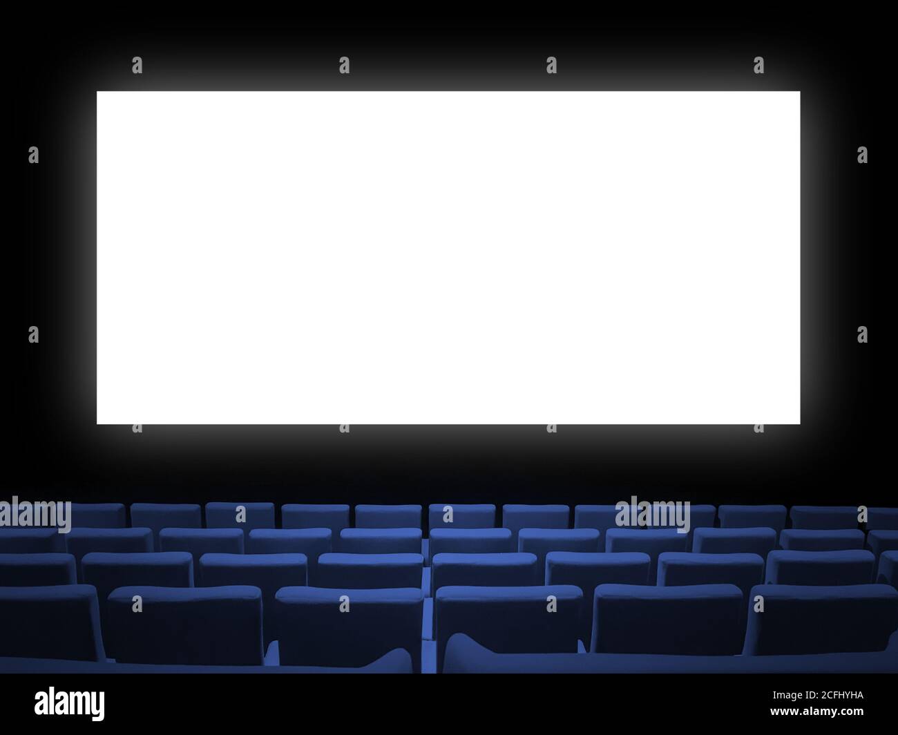 Cinema movie theatre with blue velvet seats and a blank white screen ...