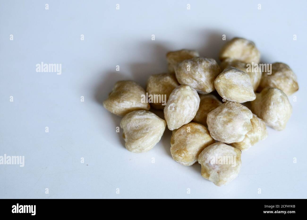 Candlenut or aleurites moluccana on white background. Stock Photo