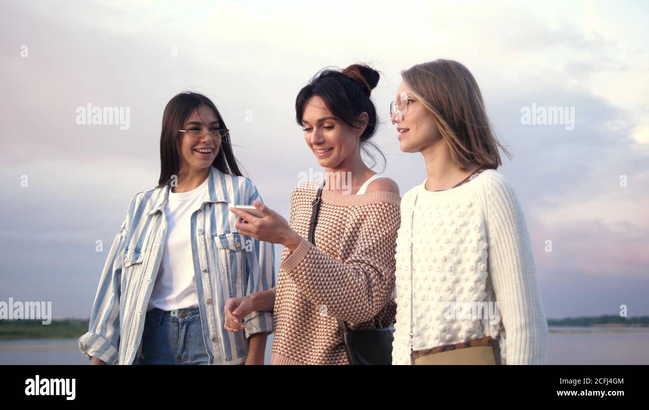 Woman using a smartphone voice recognition function online while Stock Photo