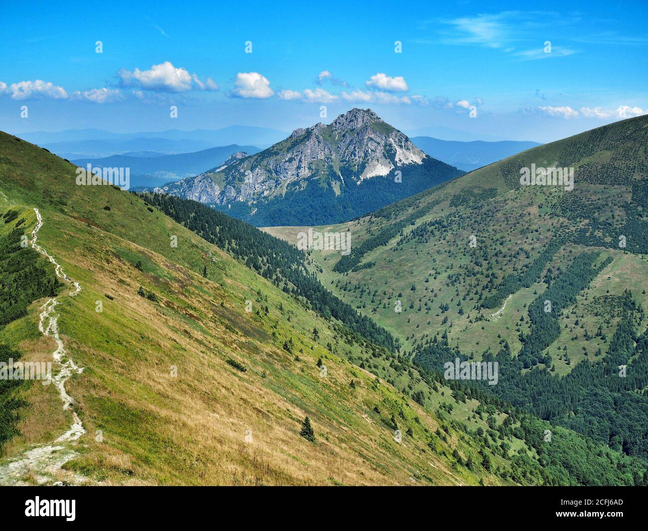 View on stony peak Big Rozsutec in The Little Fatra National Park with blue sky and clouds on background. Slovakia, August 2018. Stock Photo