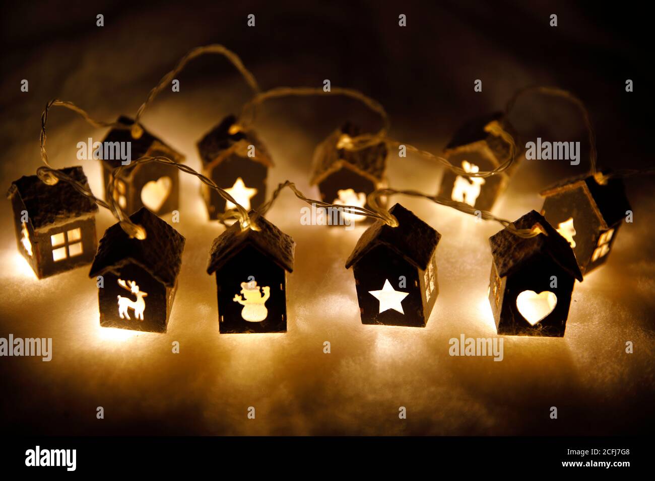 Lightened little houses with Christmas time motifs Stock Photo