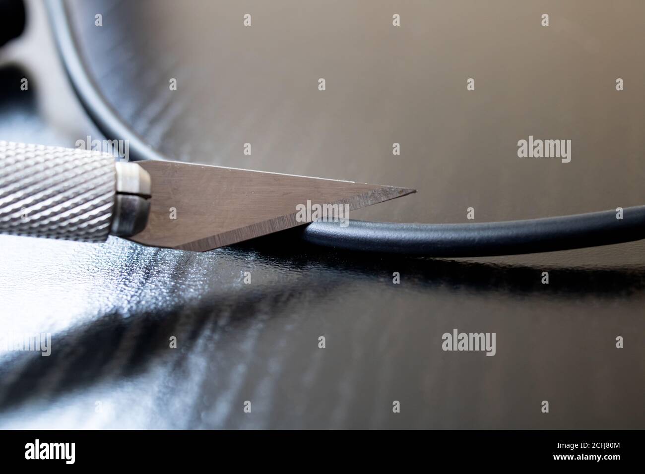 Cut thick wire with an engineering scalpel Stock Photo Alamy