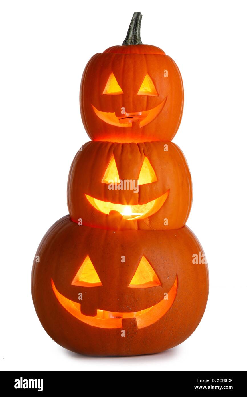Pile of glowing Carved Halloween Pumpkins isolated on white background ...