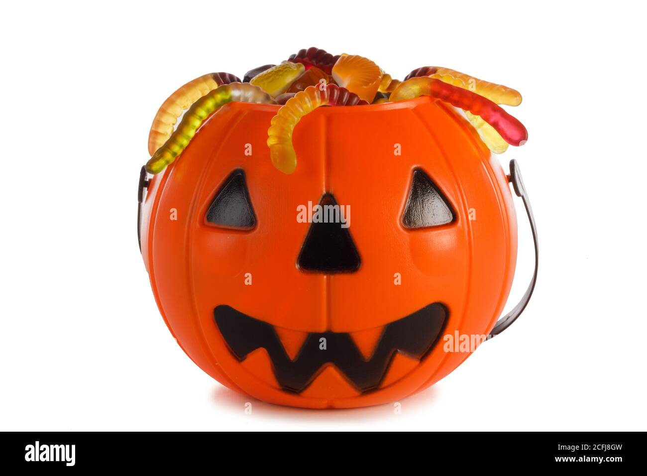 Halloween Jack o Lantern candy collector with worm candy isolated on