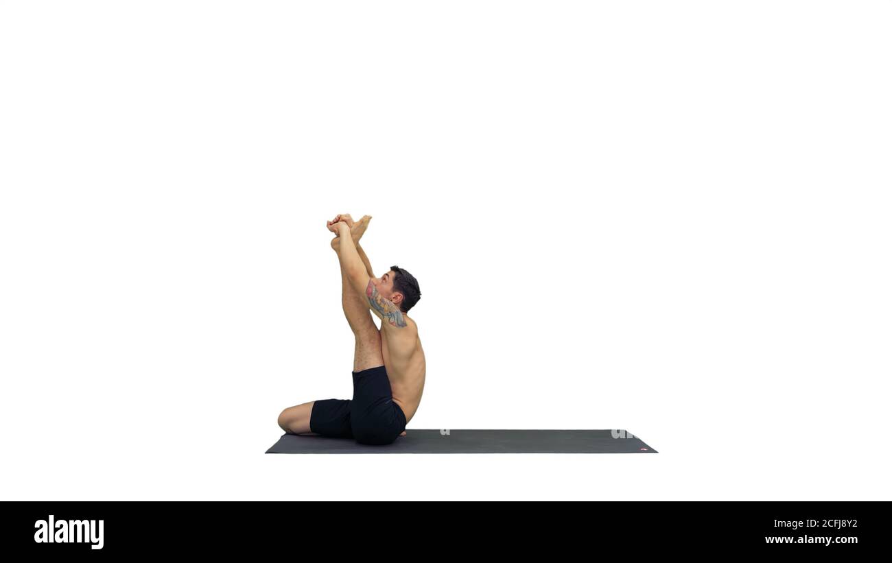 Male yoga teacher in heron pose Intense hamstring stretch Flexibility