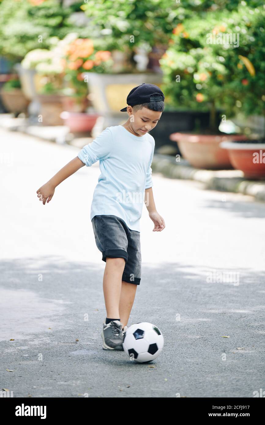 Kid Bouncing Soccer Ball Stock Photo Alamy