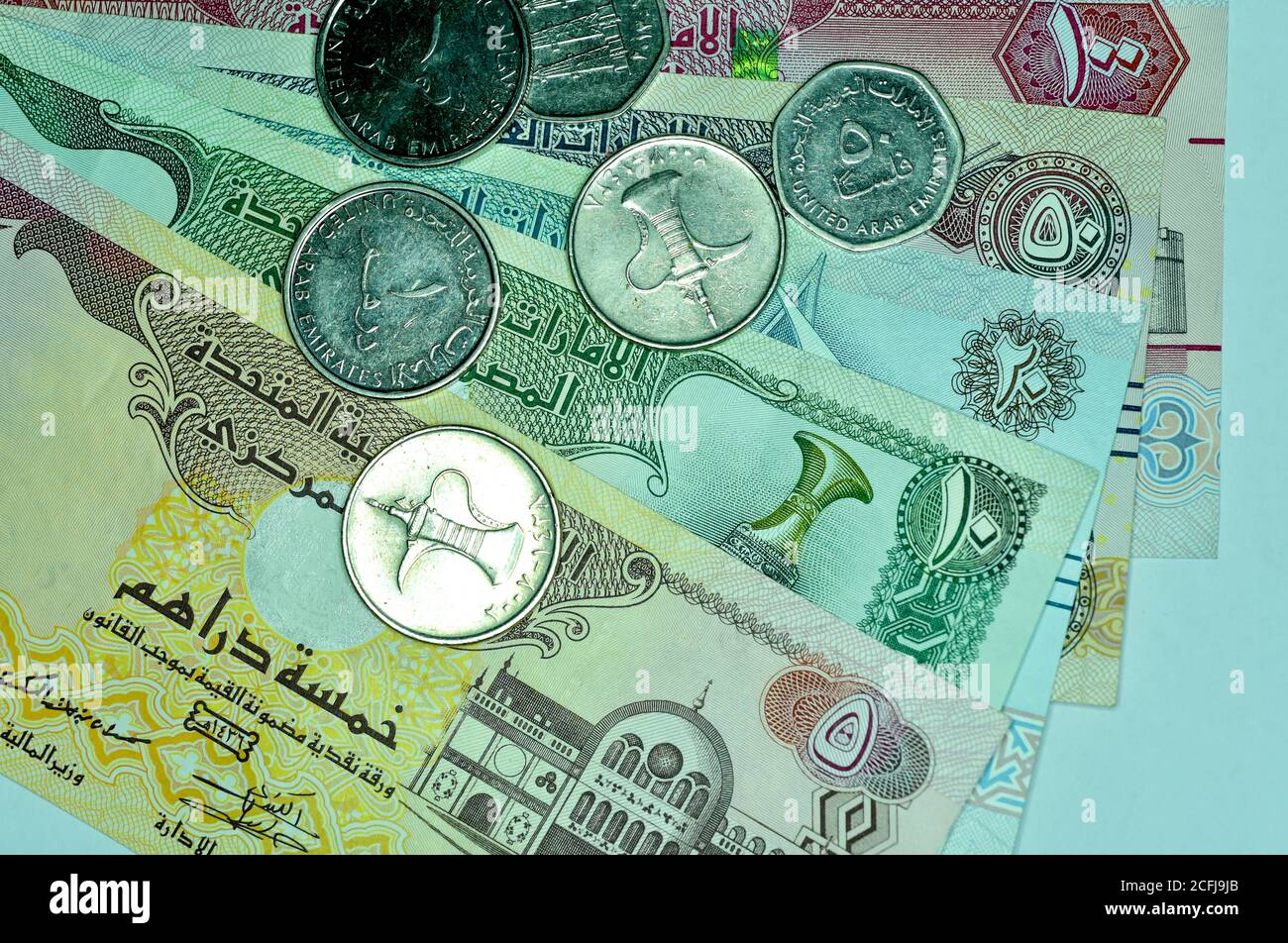 Close up United Arab Emirates Currency Dirhams And Fils Dubai Abu close-up-united-arab-emirates-currency-dirhams-and-fils-dubai-abu