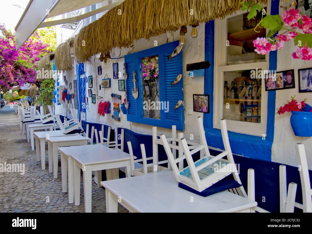 colorful and stone houses in narrow street in Alacati cesme, izmir Stock Photo