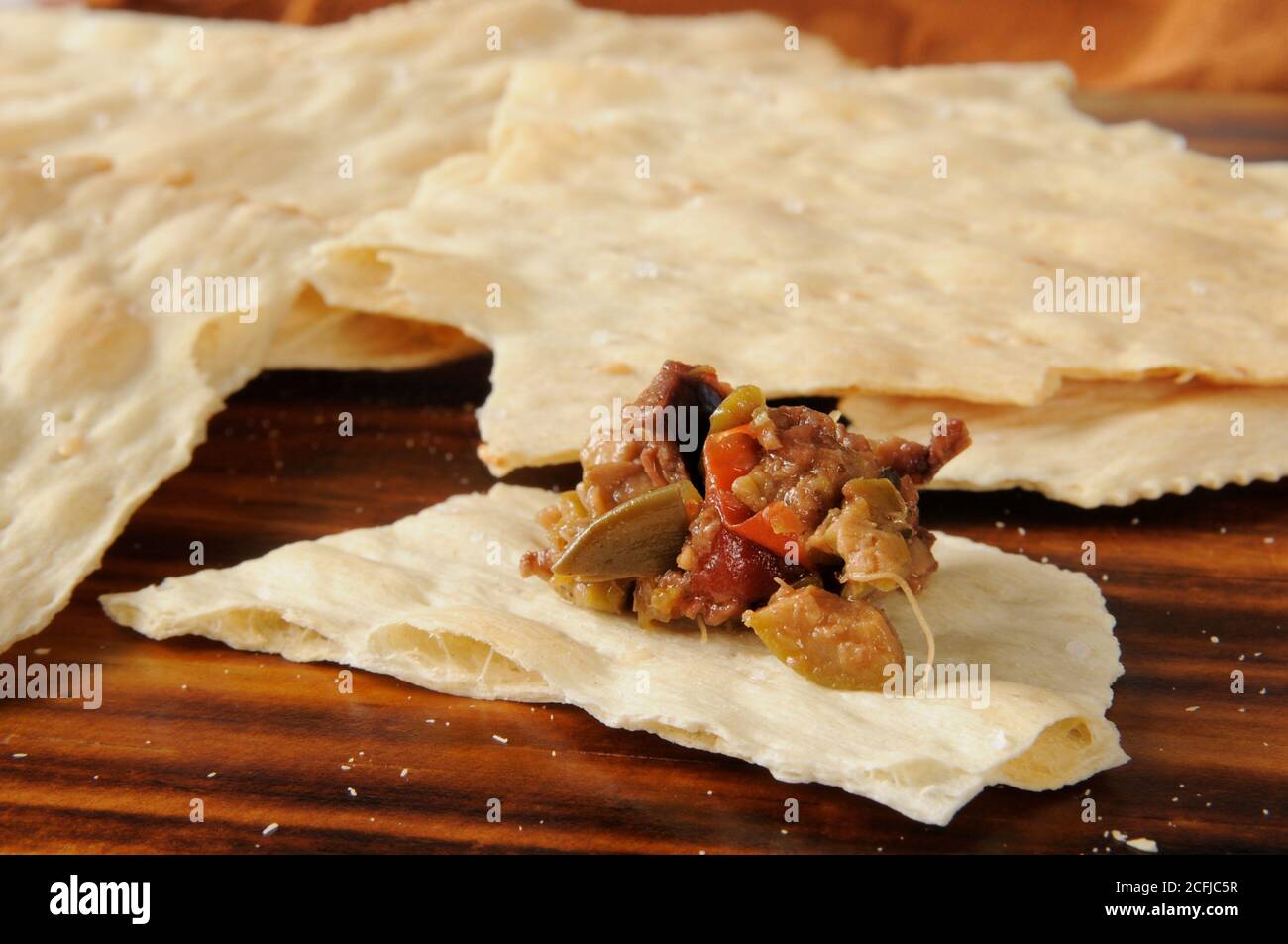 Black and green olive bruschetta on sesame flatbread Stock Photo Alamy