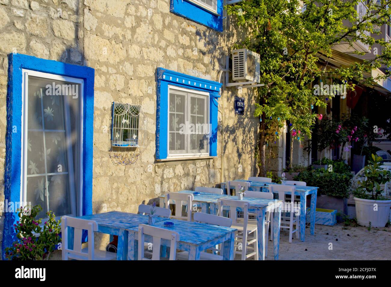 colorful and stone houses in narrow street in Alacati cesme, izmir Stock Photo