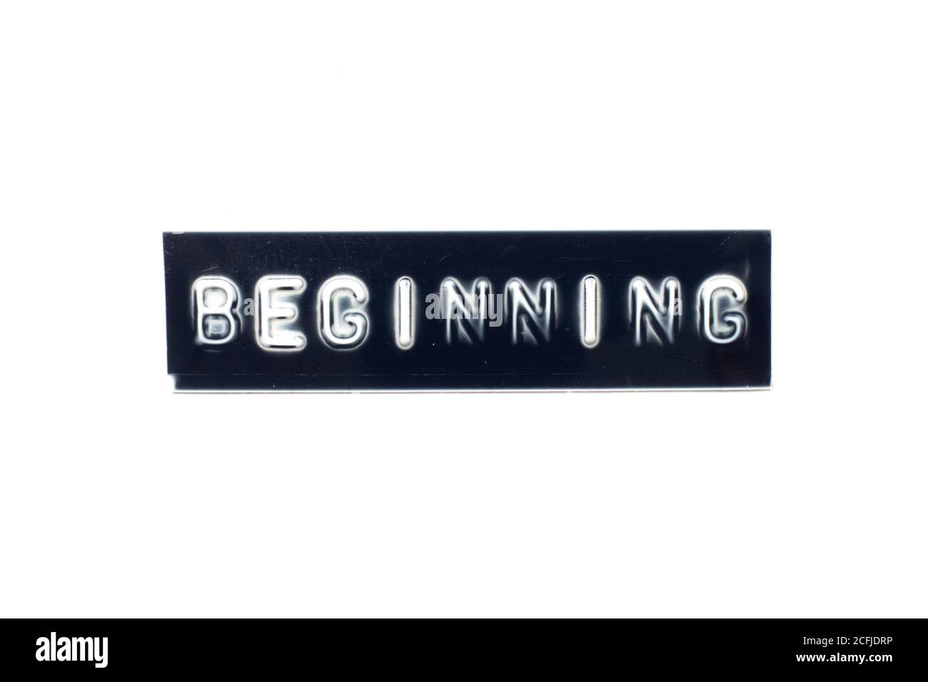 Embossed letter in word beginning on black banner with white background