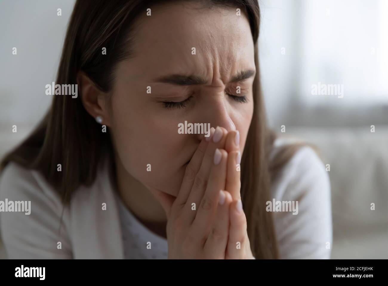 Depressed unhappy young woman suffering from personal psychological problems. Stock Photo