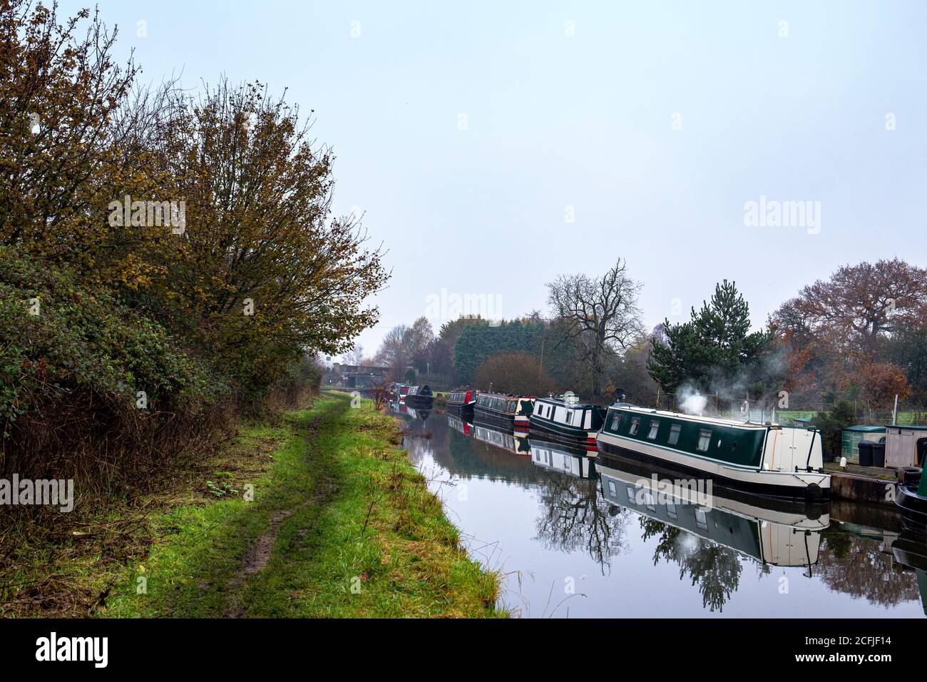 Narrow boats on the Trent and Mersey canal in winter near Sandbach Cheshire UK Stock Photo