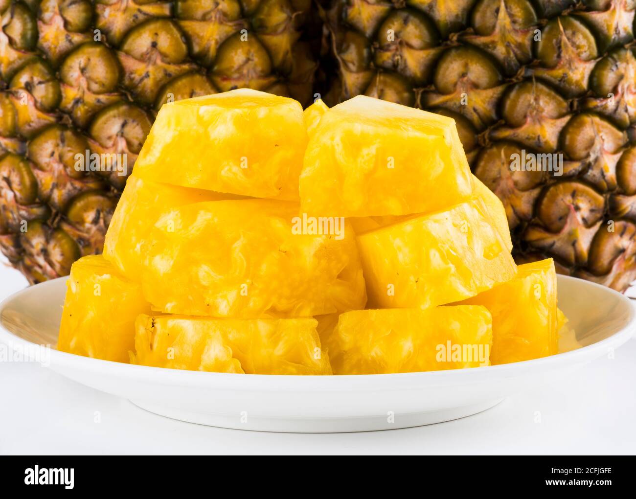 Sliced of pineapple on white background Stock Photo